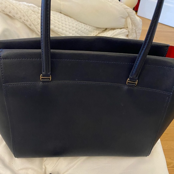 Tory Burch zip up Robinson navy blue tote with orange interior. - Picture 10 of 11
